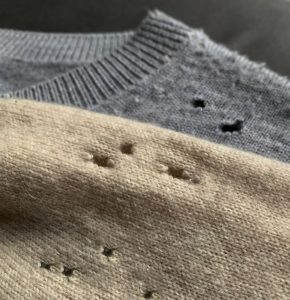 2 cotton jumpers with holes in from clothes moths