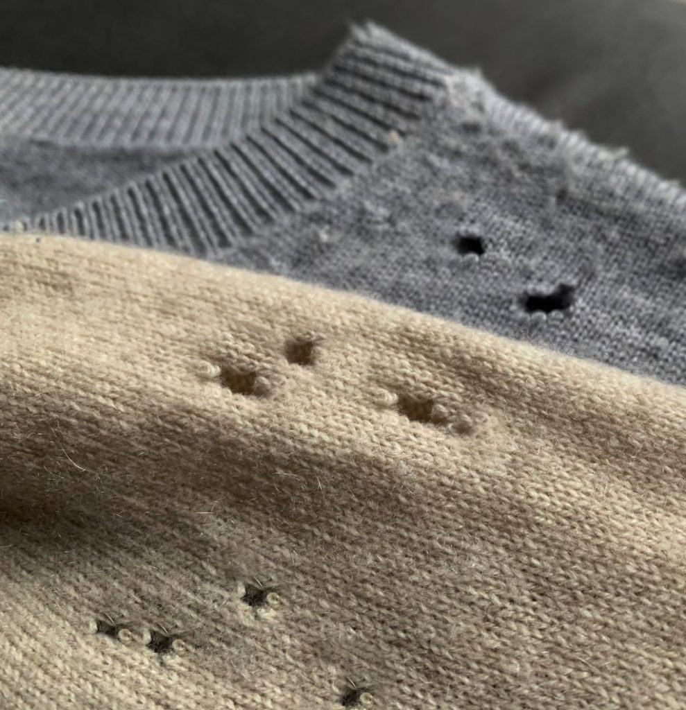2 cotton jumpers with holes in from clothes moths